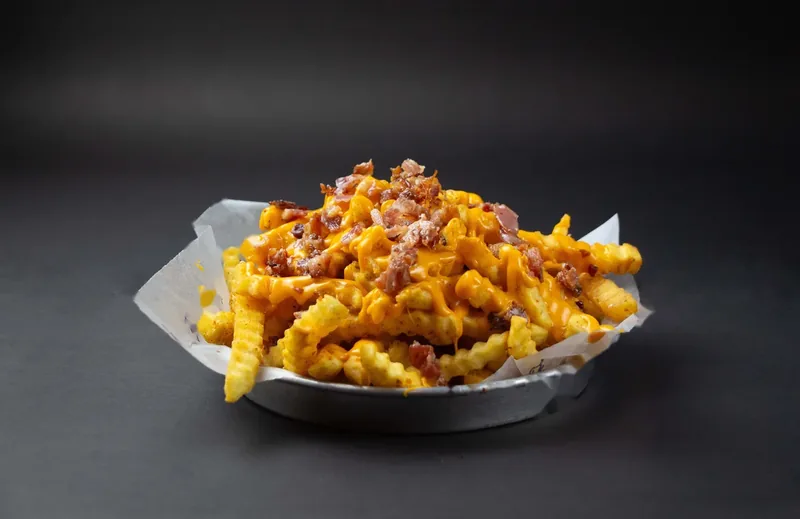 Papas fritas con cheddar